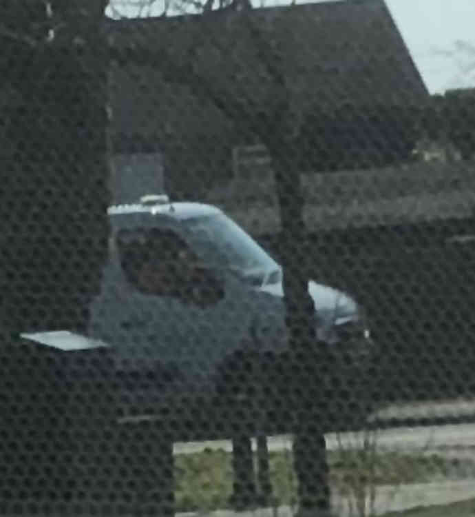 Two workers were pictured sitting together for more than 15 minutes in this truck parked on London Road in Stanford-le-Hope, while other colleagues were grass cutting.