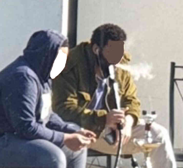 Residents on Oak Road smoking from a hookah. The picture has been anonymised.