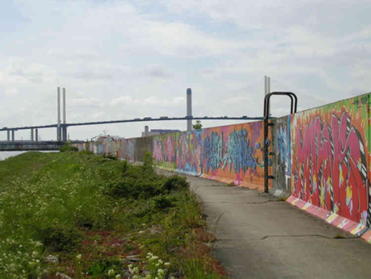 The QEII bridge and the graffiti covered sea wall.