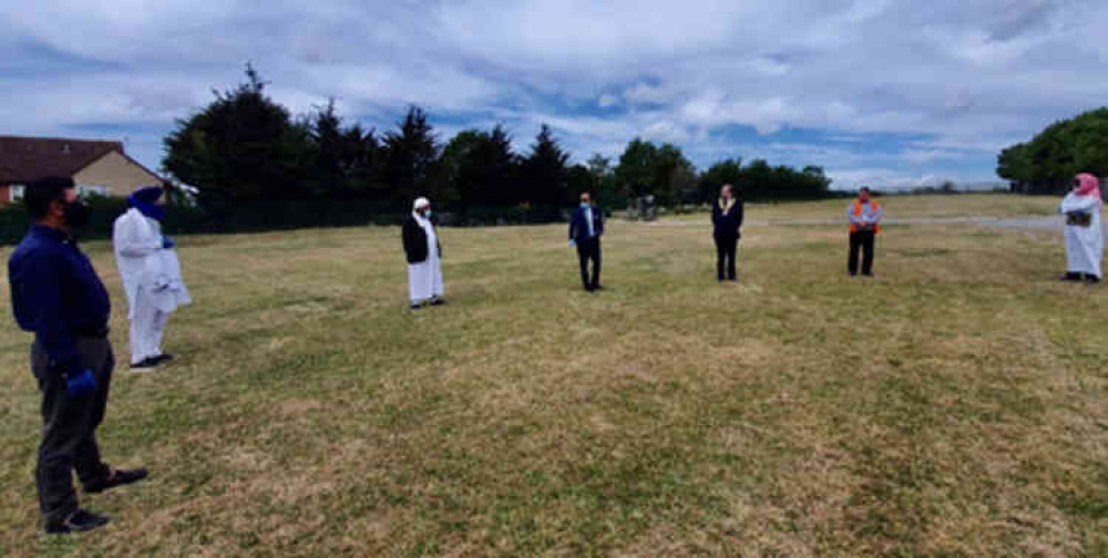 Cllr Qaisar Abbas joins Mayor Terry Piccolo and five faith leaders in blessing the land, with all attendees adhering to social distancing.