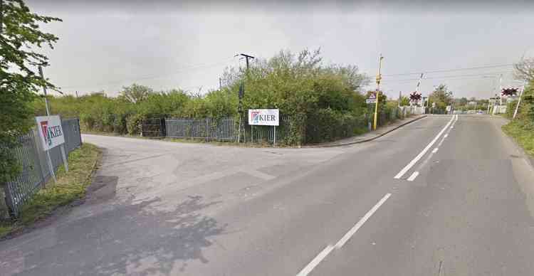 The current entrance to the site close to the rail crossing.