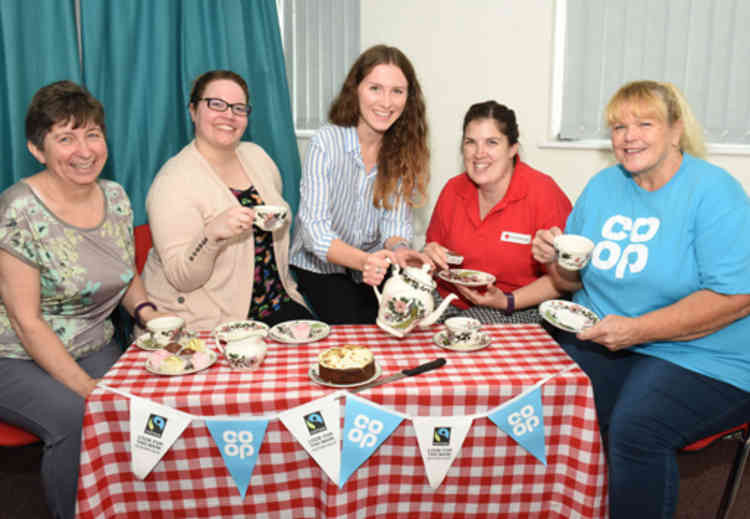 Member Pioneer, Sheila Elsey, helps out at a local tea party supported by the Coop to help combat loneliness.