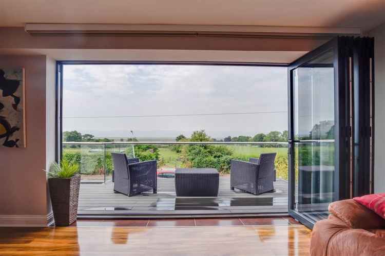 Bi-folding doors open on to the balcony