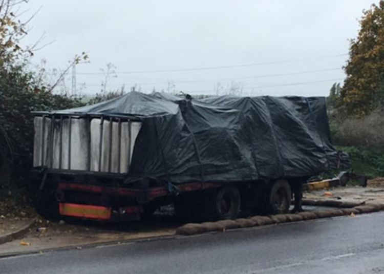 This trailer is leaking an oily substance onto the road.