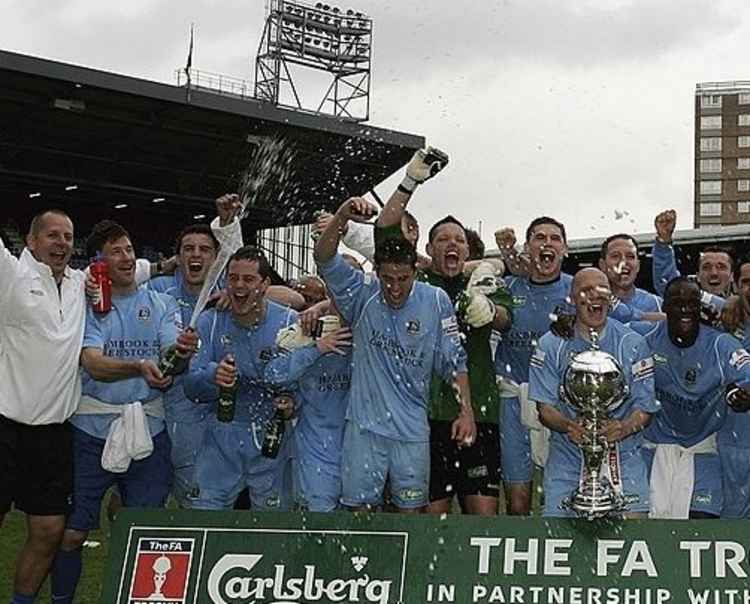 Happier days as Stuart Thurgood holds the FA Trophy.