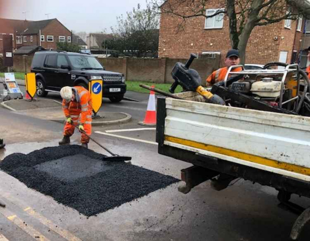 Workers creating the new London Road speed bumps this morning.