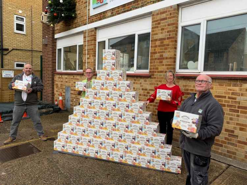 Managing Director Peter Wiffen with some of the H. W. Wilson team as they prepare to despatch the boxes of biscuits.