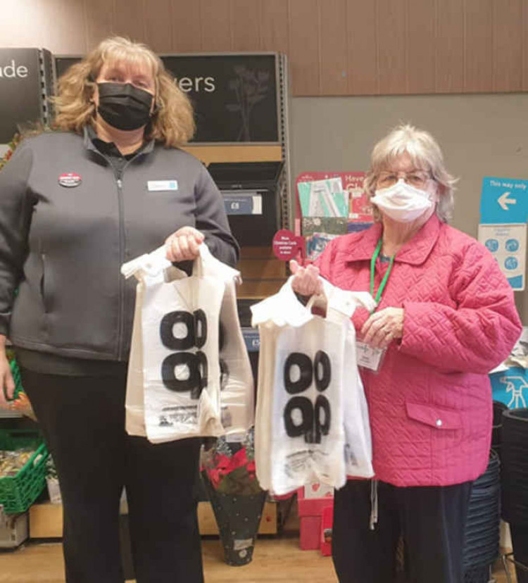 Claire Mason recently presented shopping bags to Thurrock Foodbank's Sandra Ray to help them back goods for those in need in the borough.