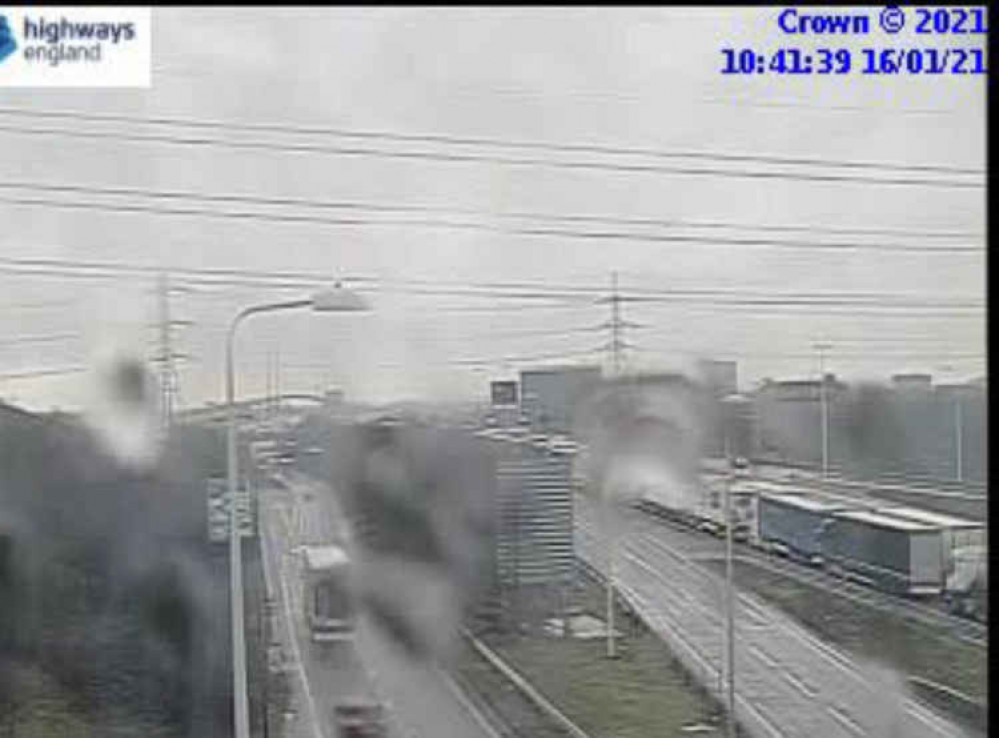 Highways England camera shows traffic backed up on approach to bridge.