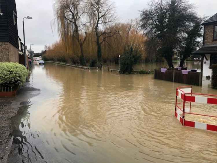 Waters threatened homes on Runnymede Road.