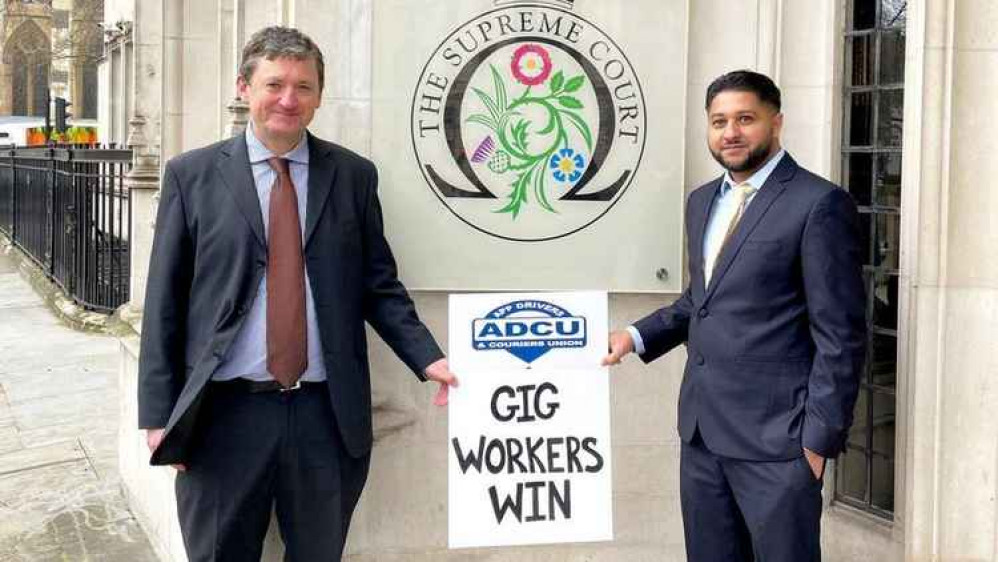 General Secretary of the App Drivers & Couriers Union (ADCU) James Farrar and driver Yaseen Aslam pose in front of the Supreme Court today.