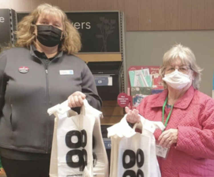 And bags of support from Claire Mason at Socketts Heath Co-op. Volunteer Sandra Ray (right) who greets our clients and packs their food into carrier bags, is pictured above receiving the donation from Claire.