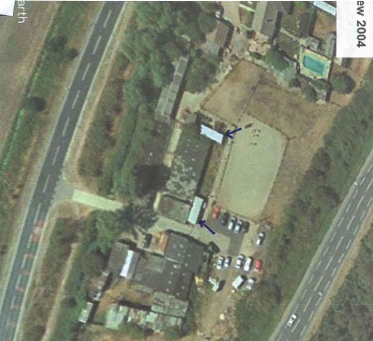 An aerial view showing the homes, reportedly taken in 2004. It certainly predates the building of the neighbouring Gateway Academy which has been open since 2009. The school's exit road is shown in later photographs put forward in evidence.