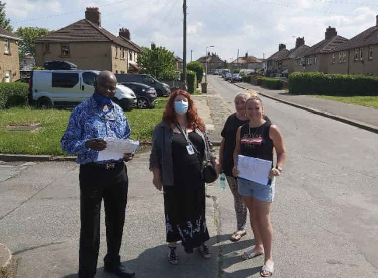 Labour councillors Sara Muldowney and Daniel Chukwu pictured with residents as they collected signatures for a petition against the housing development.