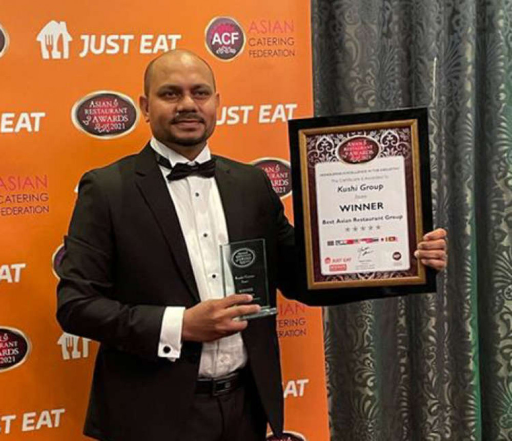 Kushi chef Kamrul Hoque proudly holds up the award.