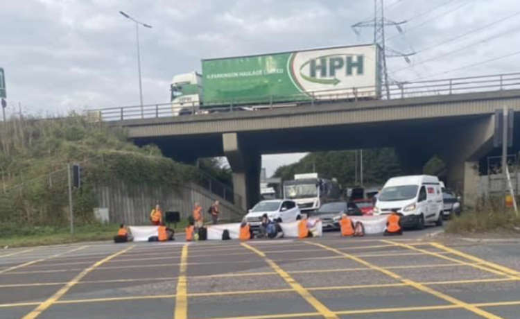 Campaigners block the roundabout at Lakeside today.