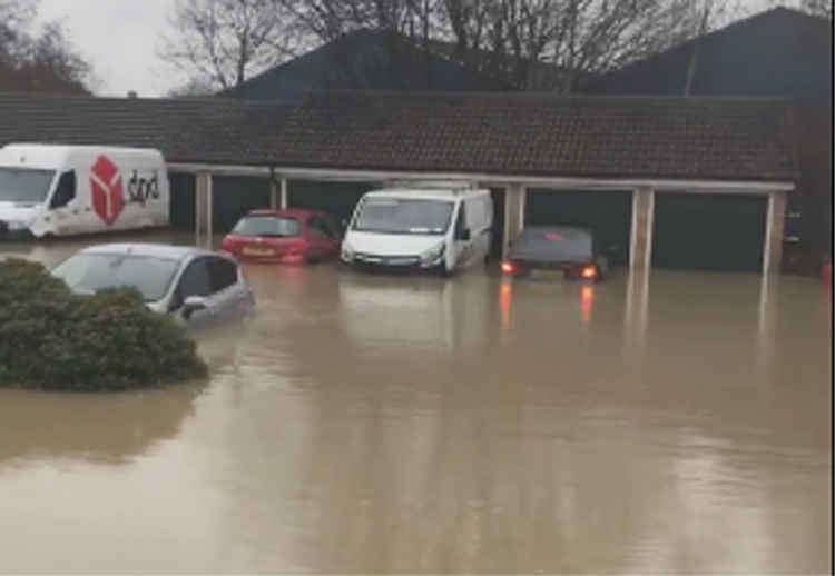 Cars were swamped by the floodwater on Bell-Reeves Close.