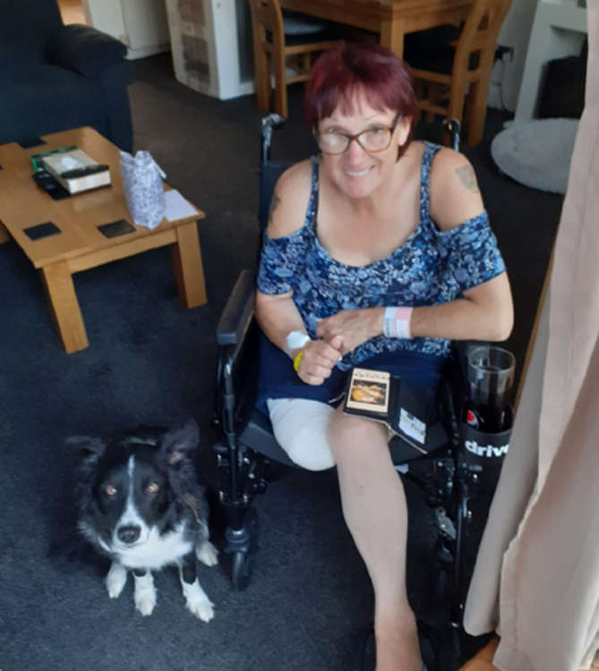 Sharon with the family's dog Belle as she recovers from her ampuation.