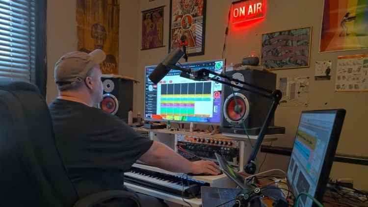 Nat Gavin at work in his home radio studio