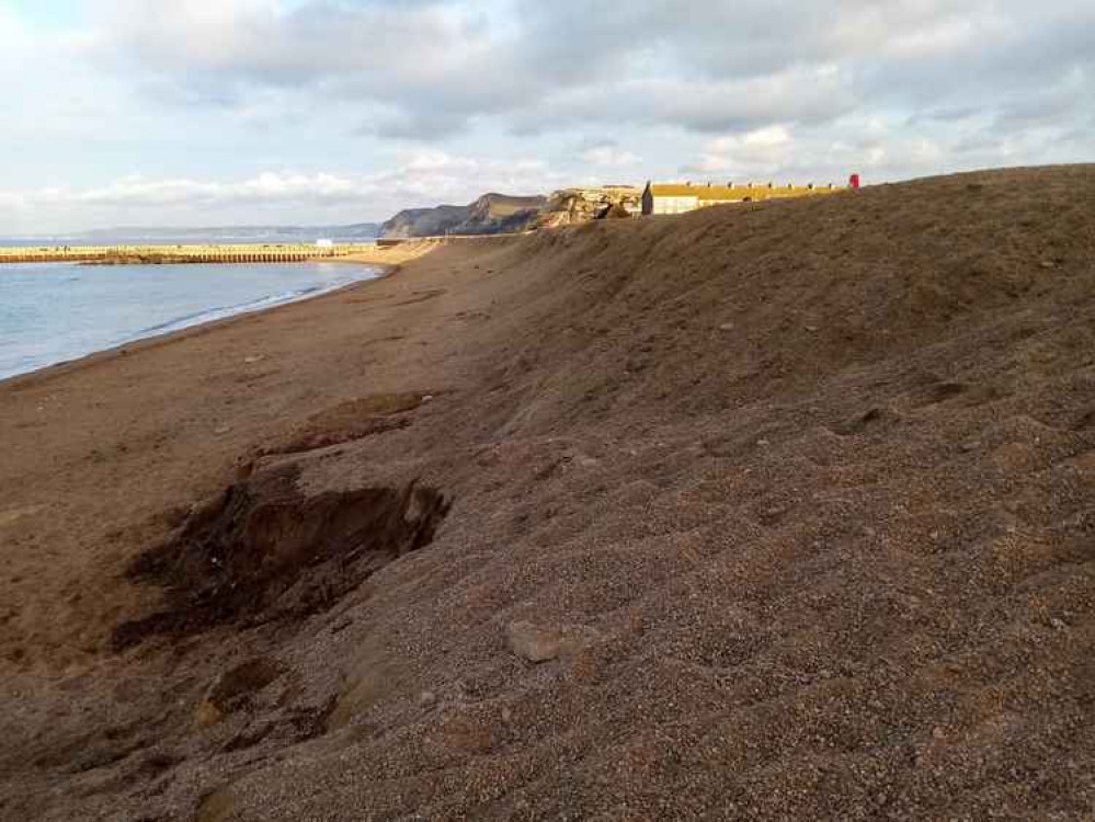 The Environment Agency says it has plans to re-profile West Bay's East Beach but reassures residents the flood defence is ready for whatever winter throws at it