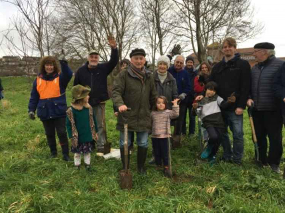 Former Bridport mayor, Cllr Barry Irvine, planting trees in 2019 in Asker Meadows