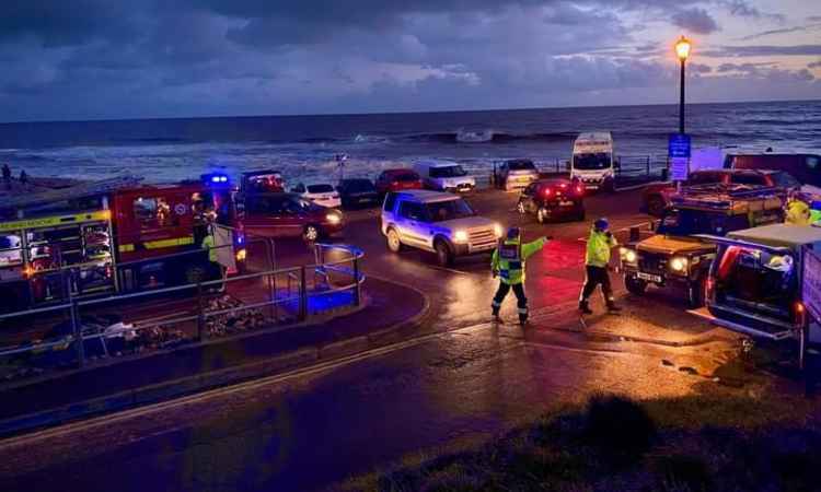 oman stuck in mud halfway up cliff at Charmouth Black Ven and dog walker cut off by tide rescued by coastguards Picture: West Bay Coastguard