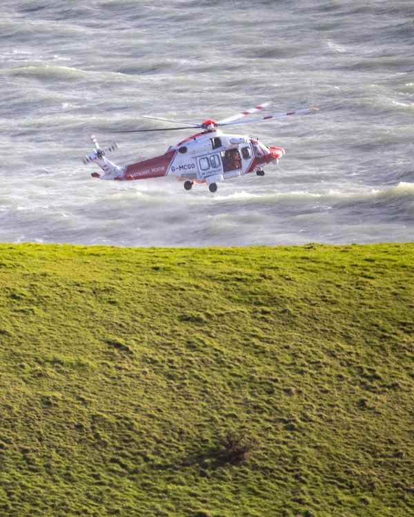 The coastguard helicopter at the scene Picture: Neil Barnes