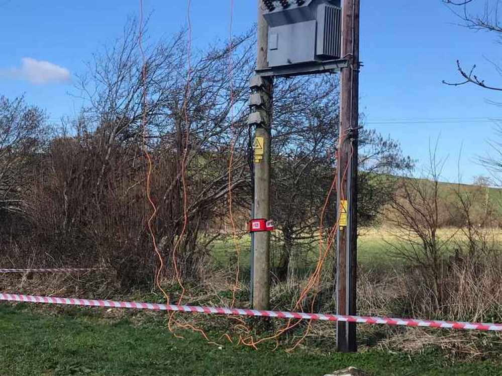 Orange cables were seen hanging from an electricity pole Picture: Bridport Fire Station