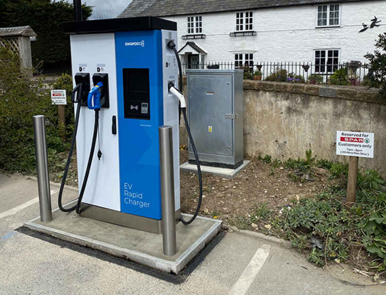 The electric vehicle charging point installed by Highways England in the central Chideock car park