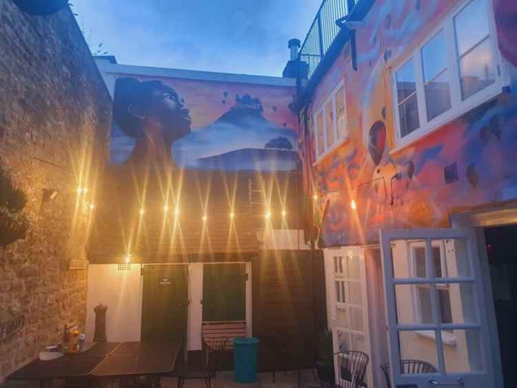 The new mural in the Green Yard Cafe courtyard