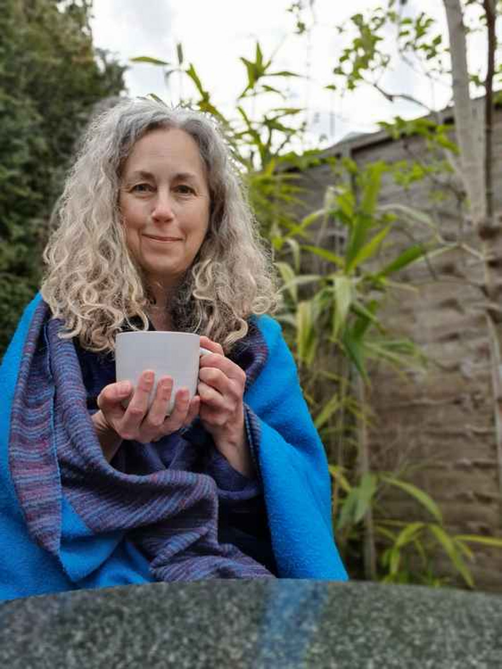 Nicole starting the day in her garden watching birds Picture: The Wildlife Trusts