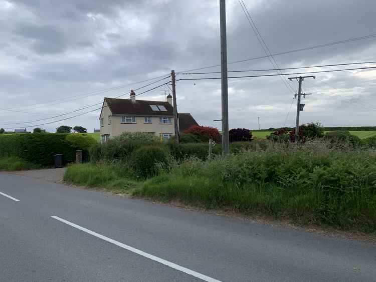 Where the lane meets the road, turn left and cross the road, going down a path into a field just before the house