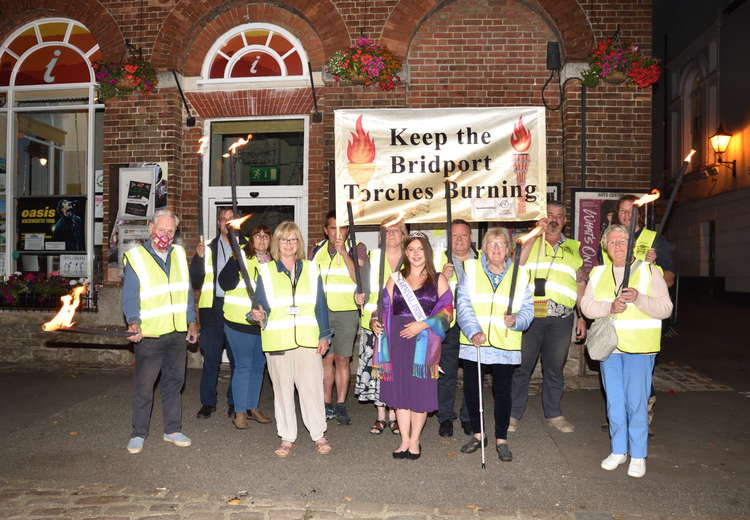 Bridport Carnival Committee and carnival princess walking the torchlight route Picture: Tim Russ