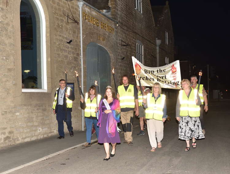 Bridport Carnival Committee and carnival princess walking the torchlight route Picture: Tim Russ