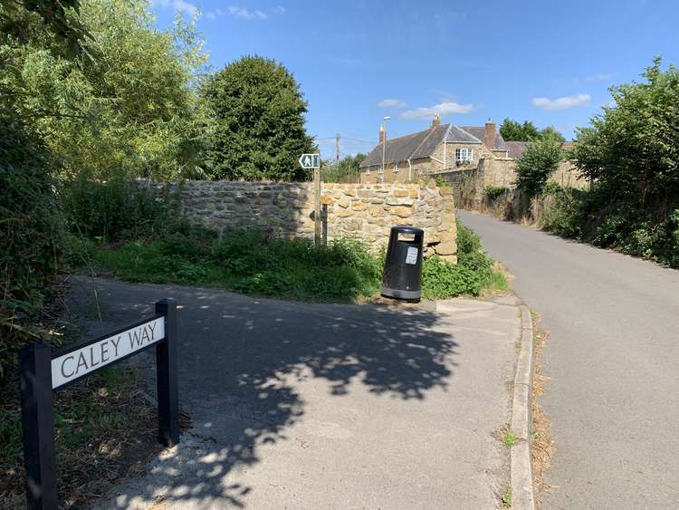 Take the left-hand footpath by a stone wall