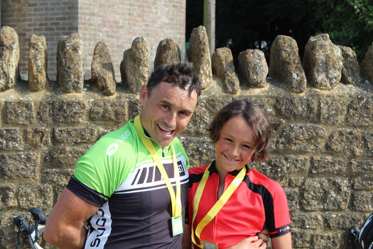 Rowan Murless, the youngest participant to complete the 55-mile route, and his dad Joseph