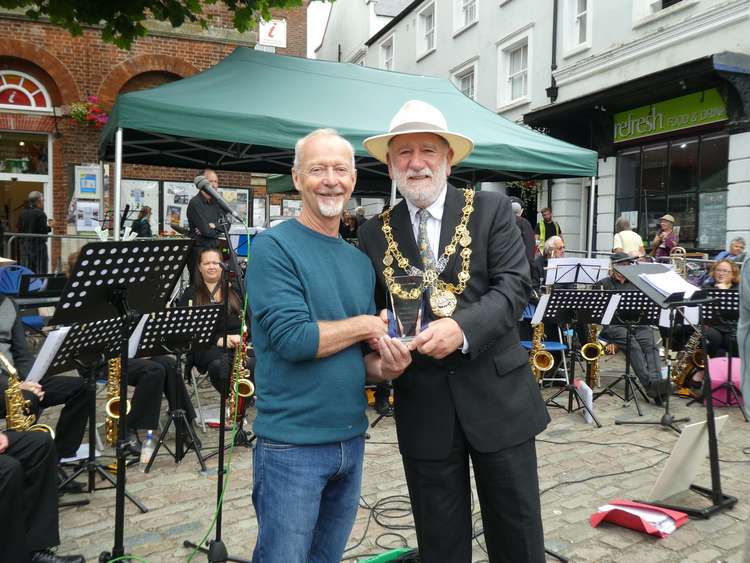 David Powell is awarded the Above and Beyond Trophy from Bridport mayor, Cllr Ian Bark