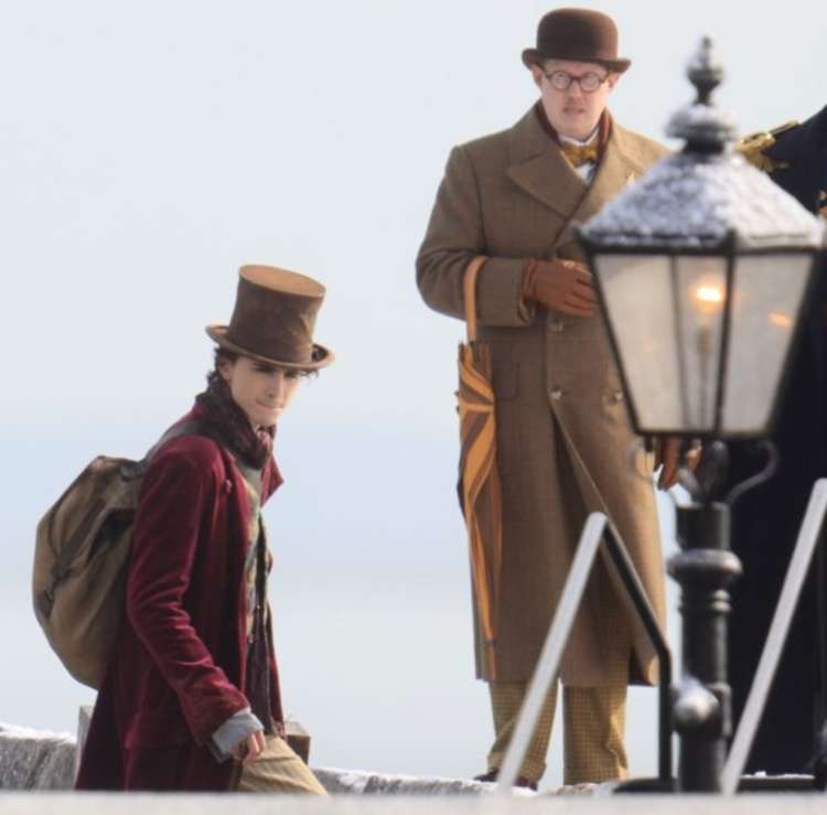 Timonthée Chalamet as Willy Wonka and Matt Lucas in costume on the Cobb in Lyme Regis Image: Richard Austin