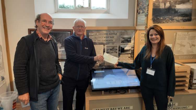 Dorset Community Energy's Pete West and Henry Lovegrove with Discovery Centre Manager Liz Bryant.