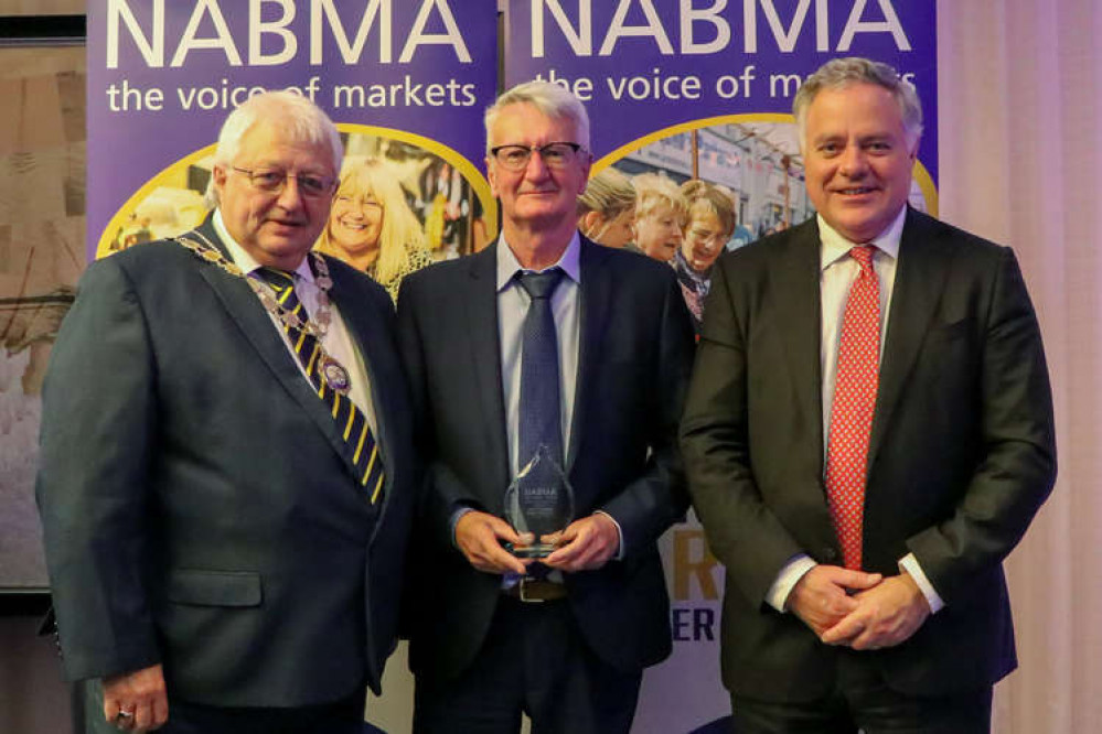 Bridport town surveyor Daryl Chambers, centre, has been awarded NABMA's lifetime achievement award