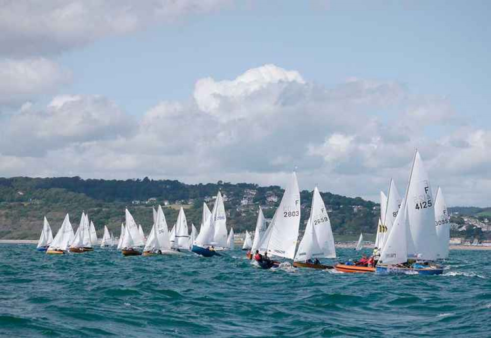 Lyme Regis Sailing Club Commodore, Rob Wiscombe, continuing the tradition of family membership of the club, sailing the Medina he owns with father John