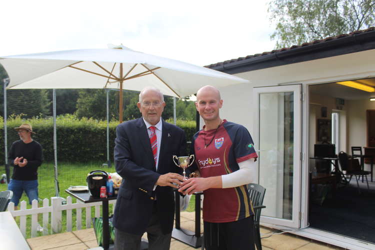 Philip Evans presents the trophy in his name to Seaton captain Joel Seward