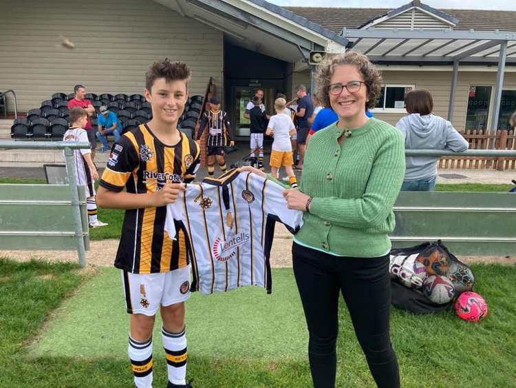 Ellen Webb, from Lentells Accountants, present news shirts to Axminster Under 13s captain Ollie Gabb