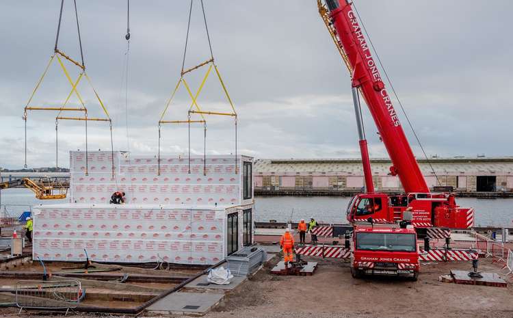 One Of The First Homes Being Craned In By The River Mersey (Credit: Urban Splash)