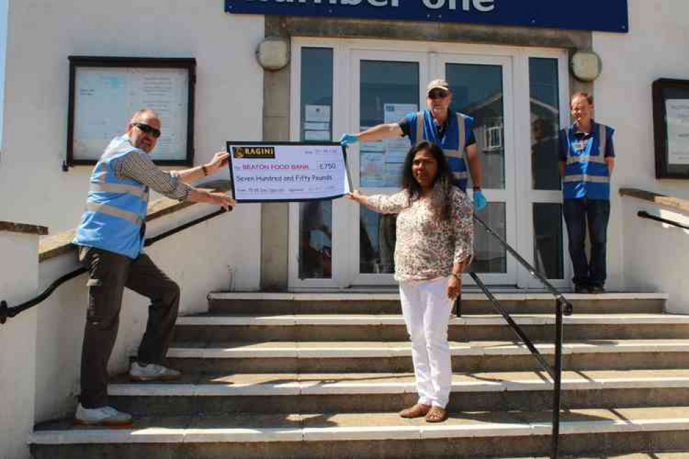 Ragini restaurant present a cheque for £750 to the Seaton Food Bank