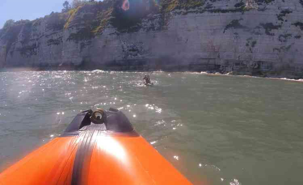 Lyme Regis lifeboat crew approach the kayakers at Beer