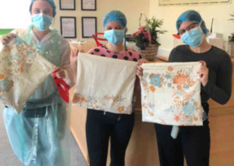 Happy care workers  with the Beer scrub bags