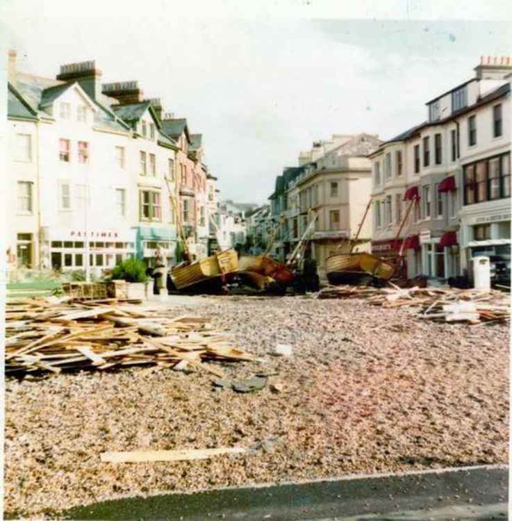 The store in the background after a storm washed up pebbles and boats from the beach in the late 1970s