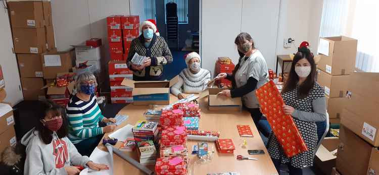 Volunteers helped to collect and organise food, pack, wrap and deliver the hampers