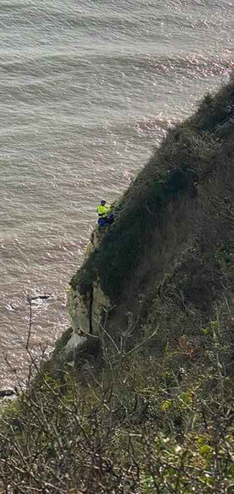 The woman was winched back up the cliff by coastguards (photo credit: Beer Coastguard)